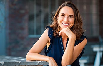 Portrait of beautiful mature woman sitting at coffee shop