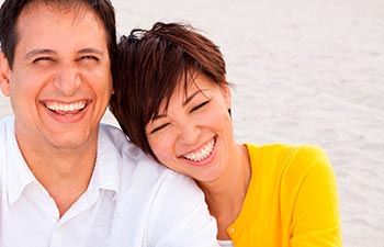 Happy mixed race couple laughing and talking