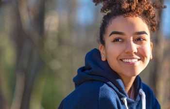 Young sporty woman showing her beautiful teeth in a smile.